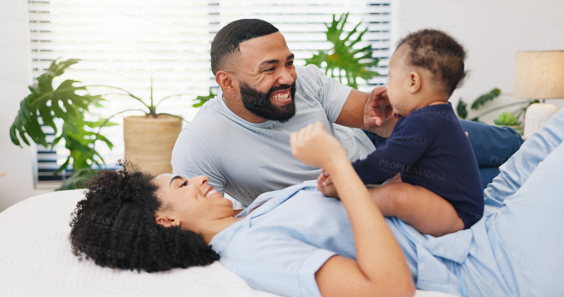 Buy stock photo Love, parents and playing with baby on bed for development, security and bonding together. Happy family, african people and relax with child in home for connection, infant care and morning routine