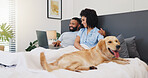 Smile, couple and laptop with dog on bed for research, online application and pet insurance. Happy, people and labrador breed with pc for animal health cover, premium benefits and vet claims at house
