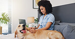 Smile, woman and laptop with dog on bed for research, online application and pet insurance. Happy, female person and labrador with pc for animal health cover, premium benefits and vet claims at house