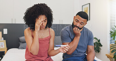 Buy stock photo Frustrated couple, pregnancy test or disagreement with stress for mistake in bedroom or home. Nervous man, woman or worry with anxiety, maternity stick or positive results in bed for concern in house