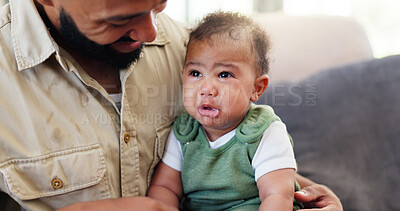 Buy stock photo Home, crying and father with baby, boy and comfort with love, wellness and bonding together. Apartment, parent and infant on couch, family and kid with tears, upset and frustrated with care in lounge