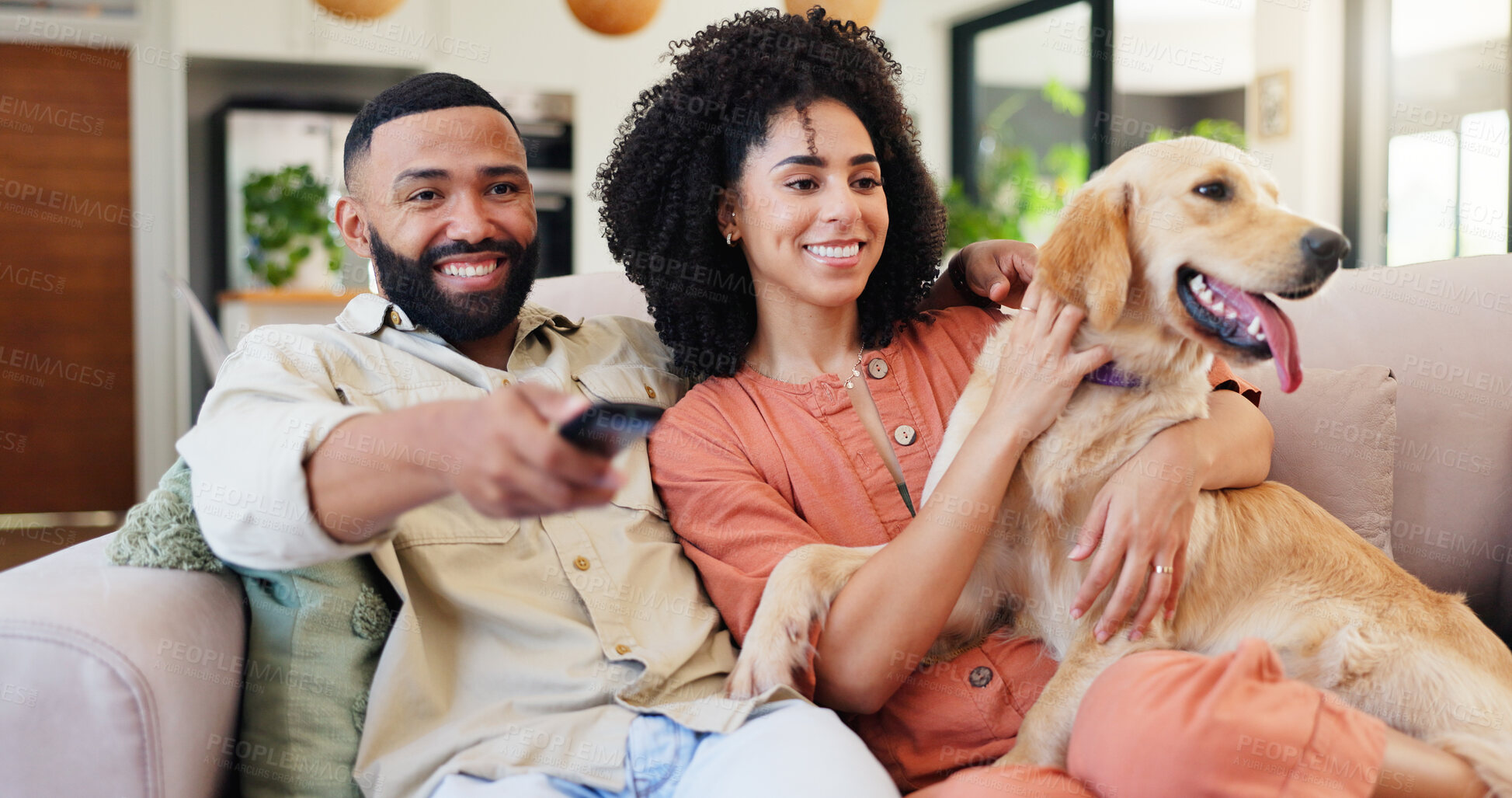Buy stock photo Couple, dog and happy for watching tv on sofa, home and relax with smile, embrace or choice for show. Man, woman and hug animal with labrador, care or television remote for streaming movies at house