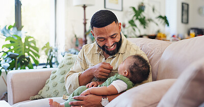 Buy stock photo Happy, home and dad with baby on sofa for bonding, loving relationship and development. Family, playful and father relax with child on couch for safety, support and care in living room together