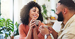 Woman, couple and happy with coffee on sofa with talk, relax and discussion with drinks in home. Person, partnership and smile for conversation, listen or tea cup on couch in living room at apartment