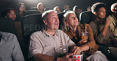 Buy stock photo Movie, theatre and senior couple with popcorn in cinema for entertainment, experience and watching film. Retirement, marriage and elderly man and woman with snacks for screening, premiere and film