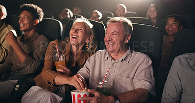 Buy stock photo Senior couple, popcorn and happy at cinema for movie in crowd, bonding and date with comedy show. Elderly people, laugh and excited with fast food, snack or relax with comic film screening at theater