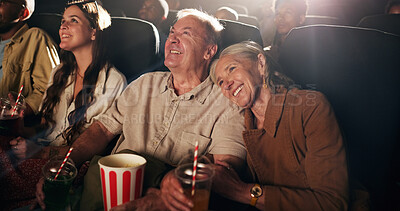 Buy stock photo Senior couple, laugh and happy at cinema for movie in crowd, bonding and date with comedy show. Elderly people, smile and excited with fast food, popcorn and watch comic film with love at theater