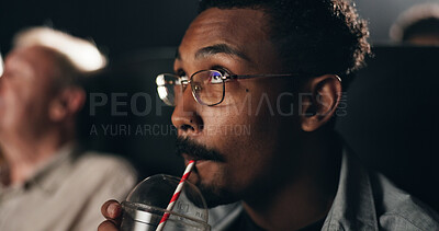 Buy stock photo Drinking, beverage and man in movie theater, premiere or fan with glasses at night or entertainment. Watching, film and person with liquid for break, evening and spectator at cinema and projection