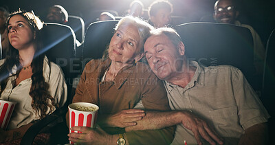 Buy stock photo Senior couple, popcorn and sleep at movie theater with smile in crowd, bonding and show on date. Elderly people, relax together and love with fast food, snack and care with film screening at cinema