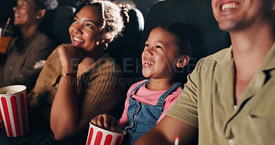 Buy stock photo Movie, theatre and child with popcorn in cinema for entertainment, experience and watching cartoon. Family, parents and happy girl with snacks for screening, animation or film audience for production