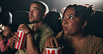 Woman, popcorn and suspense movie at theater with snack, audience and entertainment at film screening. Person, eating and thriller video with crowd, fast food and scared with horror show at cinema