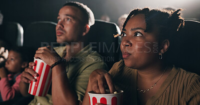 Buy stock photo Woman, popcorn and suspense movie at theater with snack, crowd and spooky entertainment at film screening. Person, eating and thriller video with audience, fear and scared with horror show at cinema