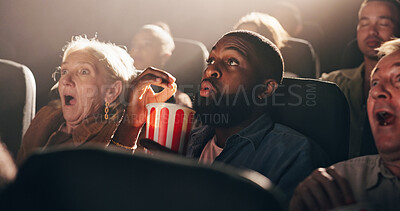 Buy stock photo Popcorn, man and movie in theater with shock for horror scene, thriller premiere and entertainment. Film screening, audience and snack with terror in cinema for scary show, fear and intense storyline