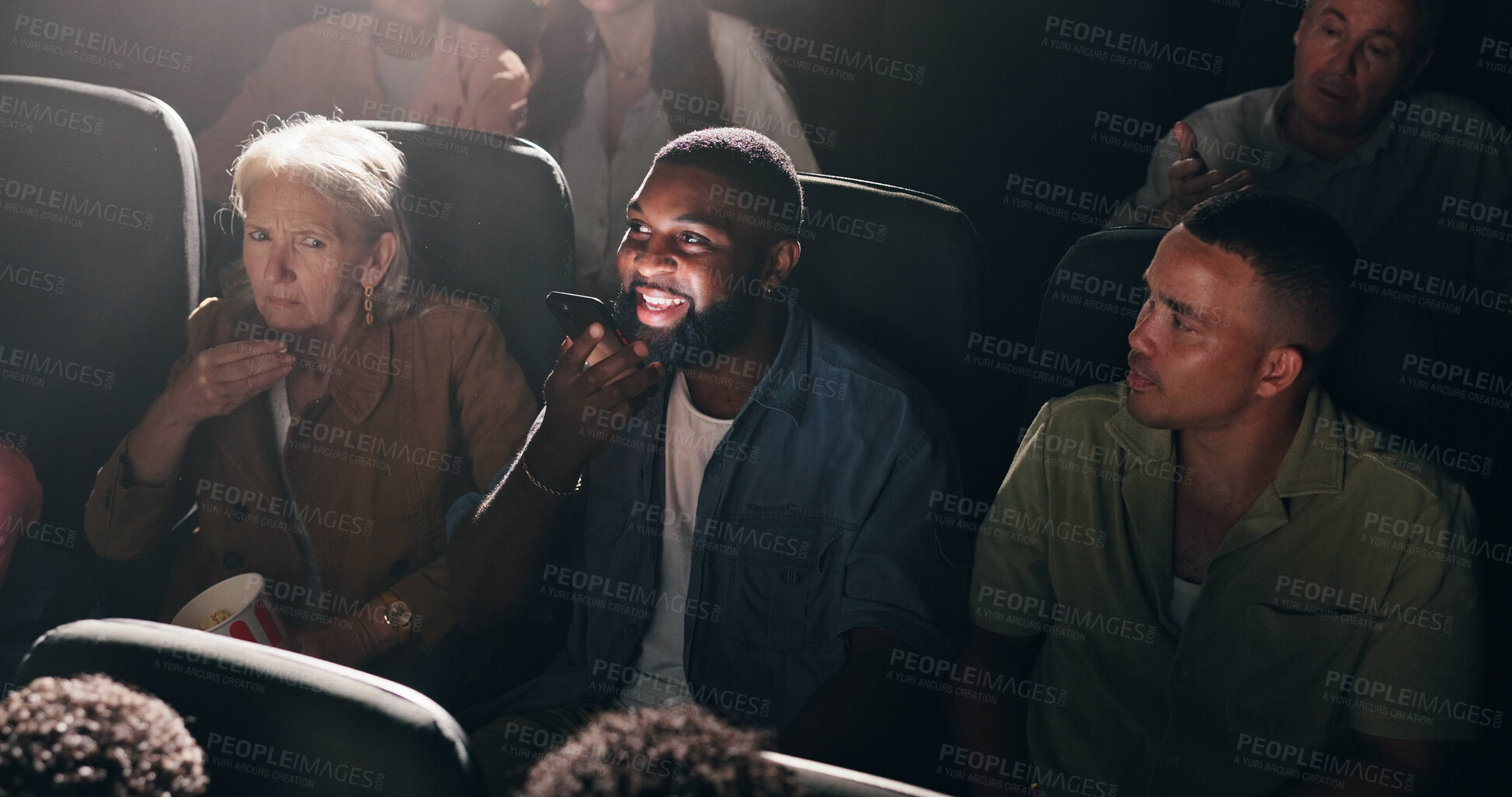 Buy stock photo Upset, watching movie and people with man, phone call and frustrated with performance. Audience, crowd and person with smartphone, annoyed and entertainment with argument, speaking and theater