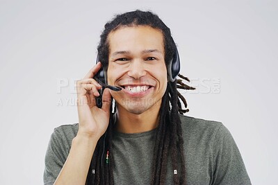 Buy stock photo African man, portrait and studio with headphones for customer service or call center, smile for communication. Male person, white background and microphone with happiness for chat or telemarketing