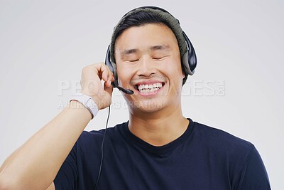 Buy stock photo Man, call center and communication for telemarketing, CRM and contact us in studio. Employee, sales worker and tech support mockup, consultant and help with laugh or male agent in white background
