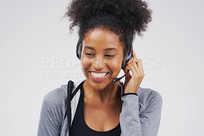 Buy stock photo Woman, smile or listening with headset in studio on white background for consultant, call centre or crm. Female person, happy and headphones with mic for support, connectivity and communication