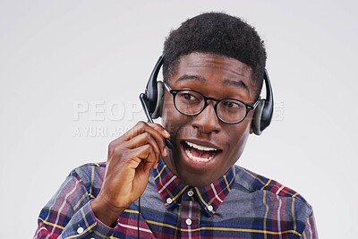 Buy stock photo African man, talking and studio with headset for customer service or call center, smile for communication. Male person, white background and microphone with happiness for chat or telemarketing
