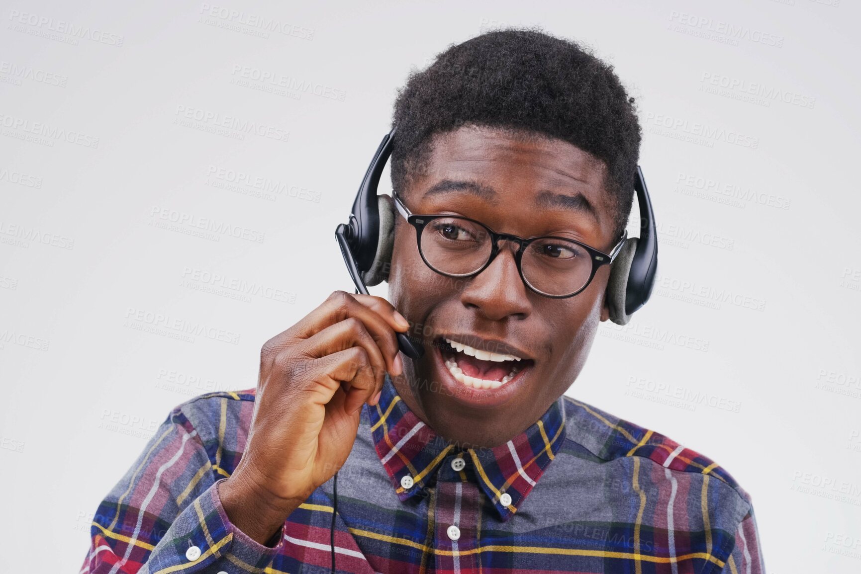 Buy stock photo African man, talking and studio with headset for customer service or call center, smile for communication. Male person, white background and microphone with happiness for chat or telemarketing