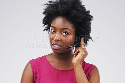 Buy stock photo Black woman, talking or listening with headset in studio background for consultant, call centre or crm. Female person, conversation and headphones with mic for support, connectivity and communication