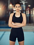 Portrait of fitness, exercise and workout woman in sport training for health and fit body in a gym. Serious, healthy or strong athlete with motivation or wellness before cardio routine in sports club