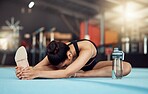 Woman stretching legs for fitness training at gym, yoga for exercise at health club and sports workout for wellness and strong body. Healthy girl doing pilates on floor and sport lifestyle motivation