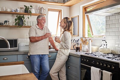 Buy stock photo Mature couple, bonding or morning coffee in kitchen of relax home or retirement house. Smile, happy or talking senior man and woman laughing with tea in trust communication, security or love marriage