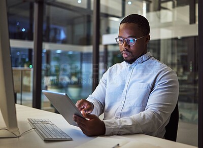Buy stock photo Black businessman, tablet and data analysis with computer in night office for digital marketing software, cybersecurity code or kpi. Thinking programmer, developer or website designer with technology