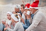Big family, drinking cocoa and relaxing for Christmas holiday, bonding and quality time together in the outdoors. Parents, grandparents and children in family celebration for December festive season