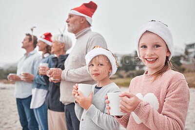 Buy stock photo Family, generations and Christmas, drink and view outdoor while on vacation, holiday and festive time at the beach. Parents, grandparents and children, happy with hot chocolate, mug and xmas hat.