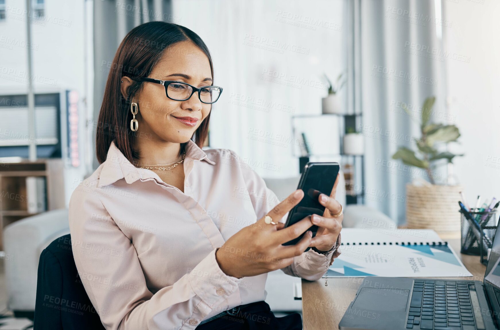 Buy stock photo Smartphone, laptop and businesswoman in office typing an email or networking on internet. Communication, technology and professional female designer doing creative research on cellphone and computer.