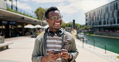 Buy stock photo Education, laughing and phone with student black man on campus of college or university for learning. Development, funny and music with happy person outdoor at school for growth, scholarship or study