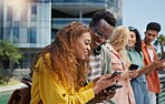 Group, students and happy with phone at university, campus or laughing for diversity, learning or development. Gen z friends. women and men on mobile app, web chat and meme on social media at college