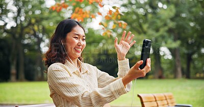 Buy stock photo Happy woman, wave and phone in park for video call, live streaming and connectivity in Kyoto. Japanese influencer, relax and outdoor with mobile for photography, content creation or virtual contact