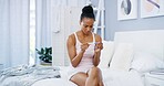 Stress, anxiety and woman on bed with pregnancy test, health and wellness in apartment. Pregnant, news and African girl in bedroom waiting for results with doubt, worry and future motherhood in home