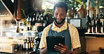 Alcohol, man and smile with tablet for small business, hospitality and tracking stock online. Restaurant, male person and bartender with digital for customer service, retail store and drinks order