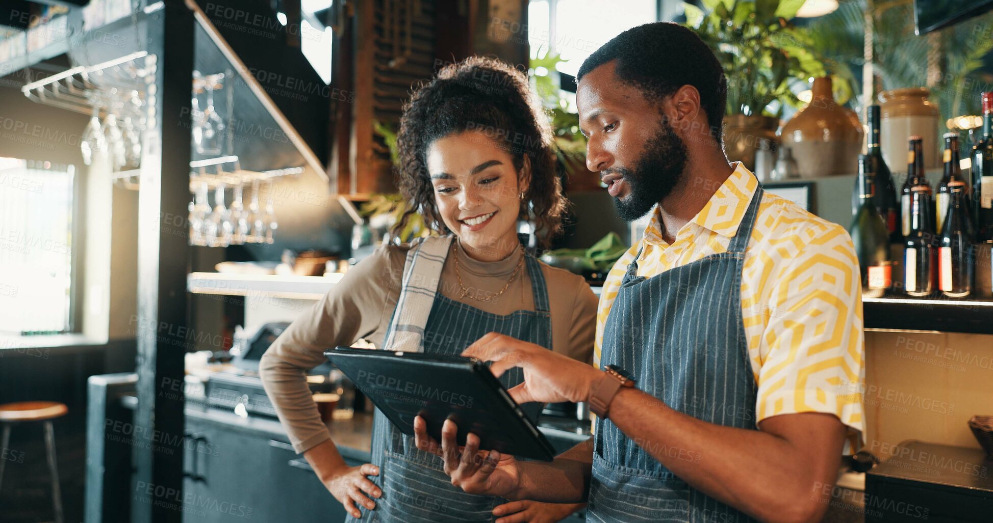 Buy stock photo Restaurant, waiter and people on tablet for training for inventory, menu items and checklist by bar. Alcohol, hotel business and man and woman on digital tech for hospitality, service or online order