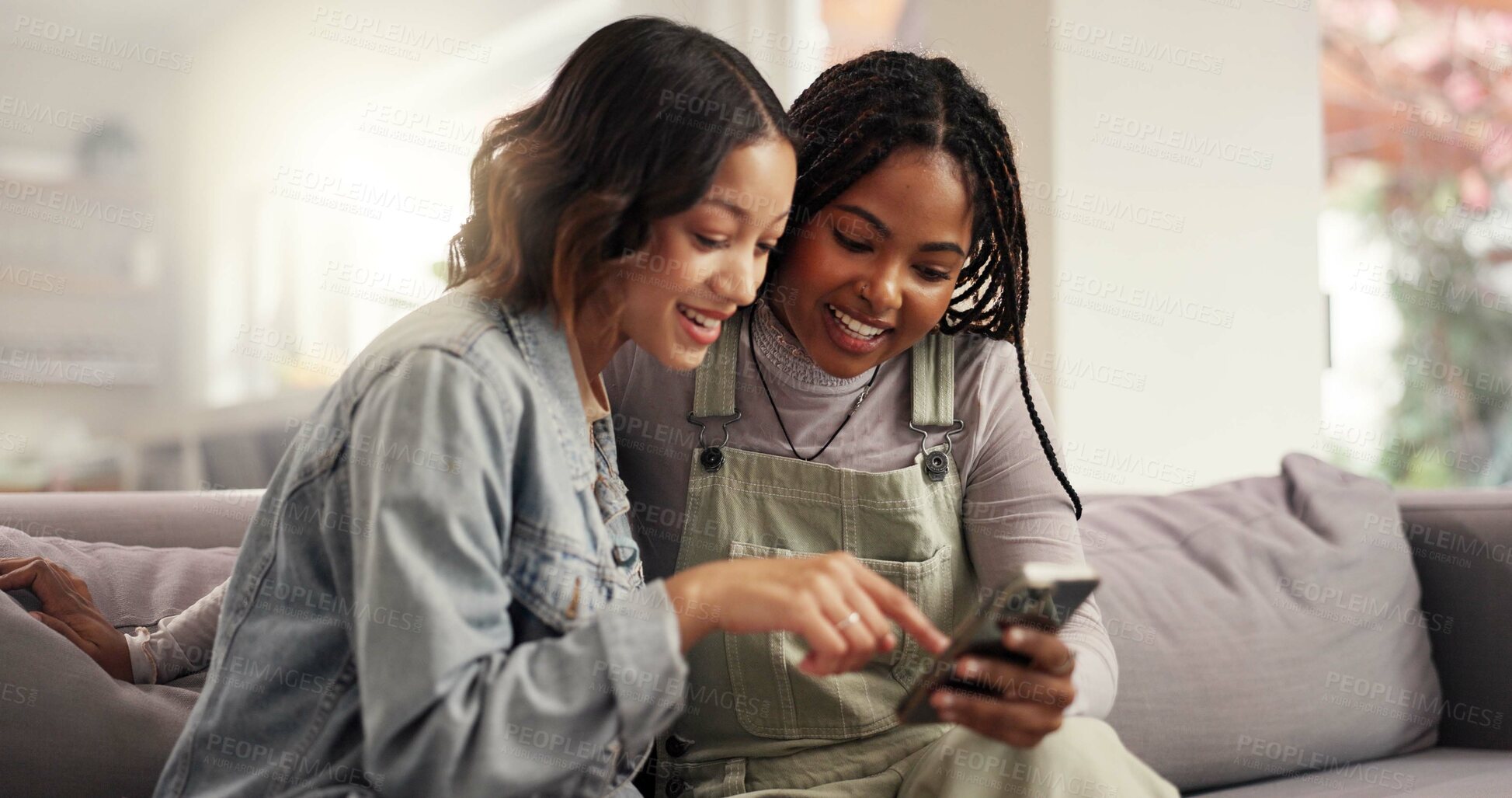 Buy stock photo Online, friends and girls with smartphone, lounge and laughing at gossip on social media and bonding. Pointing, smile and people with mobile for funny news on post, living room and together in house