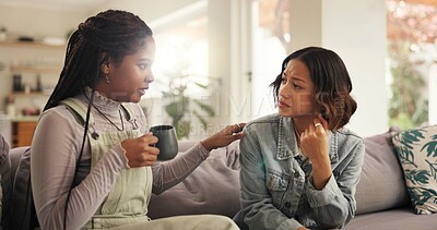 Buy stock photo Coffee, empathy and support with friends on sofa in living room of home for comfort or conversation. Advice, frustration or sadness with women speaking in apartment for help, sympathy or trust