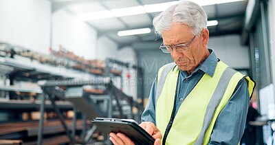 Buy stock photo Man, engineer and tablet in factory for manufacturing, distribution schedule and task checklist. Mature operator, tech and reading in warehouse for inspection notes, industrial plant and automation