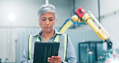 Buy stock photo Engineer, tablet and woman in factory for robotics, manufacturing or welding machine at assembly line. High tech, automation or mature supervisor with production process, industry 4.0 or cnc software