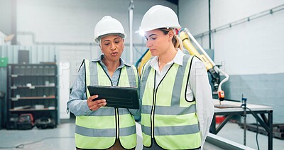Buy stock photo Women, robotics and teamwork in factory, tablet and conversation with inspection results. Employees, engineering and people in lab, tech and meeting with app, design review or system configuration