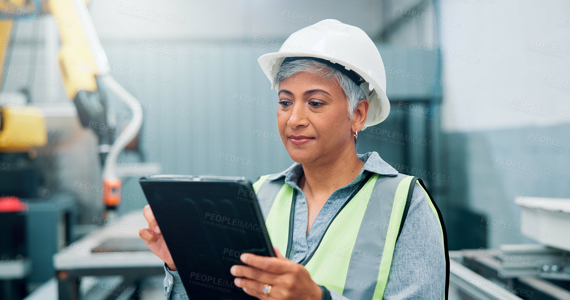 Buy stock photo Engineer, tablet and woman with robotics for production, control machine or assembly line in factory. High tech, automation and mature supervisor with manufacturing process, industry 4.0 and software