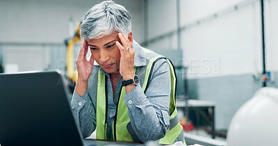 Buy stock photo Mature, woman and laptop with headache in workshop for engineering fatigue, burnout and website 404. Technical glitch, robotics software error and migraine for stress, crisis or disaster in lab