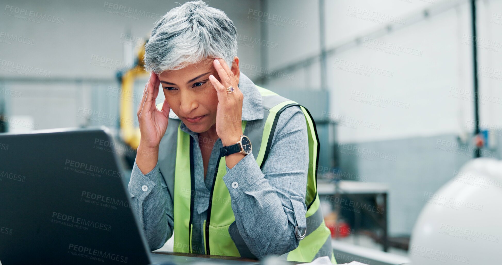 Buy stock photo Mature, woman and laptop with headache in workshop for engineering fatigue, burnout and website 404. Technical glitch, robotics software error and migraine for stress, crisis or disaster in lab