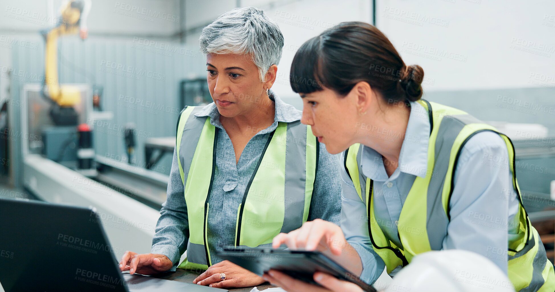 Buy stock photo Laptop, engineer team and women in meeting for planning, discussion or communication at factory. Female employees, collaboration and brainstorming for robotics with tech, software and programming