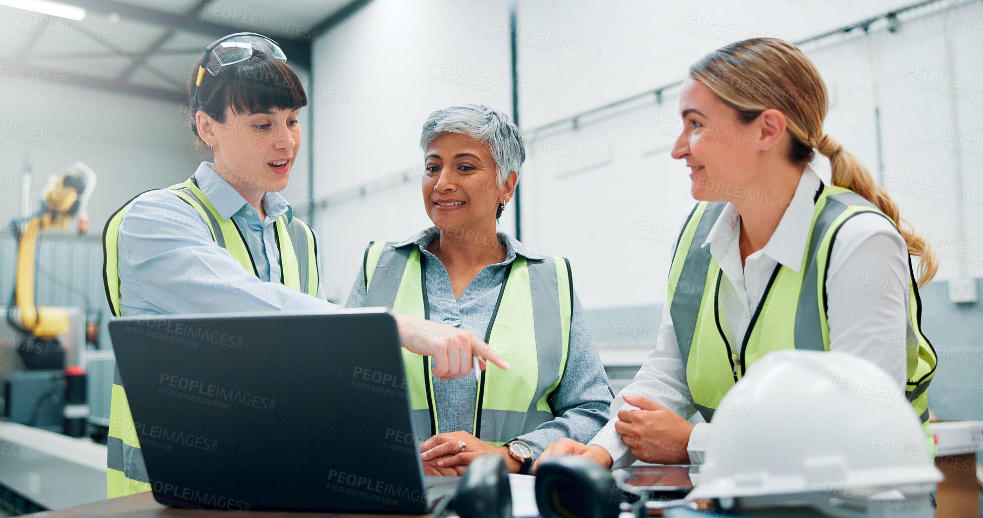 Buy stock photo Engineer, women team and technology in meeting for planning, discussion or communication at factory. Female employees, collaboration and brainstorming for robotics at assembly line for innovation