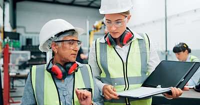 Buy stock photo Women, engineers and discussion of team with paperwork, inspection and update at factory. Female employees, collaboration and walking for manufacturing with quality control, manager and robotics