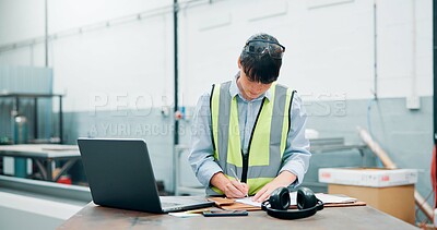 Buy stock photo Engineer, laptop and writing in factory for manufacturing, planning and admin checklist. Woman, employee and technology in industrial company with notes, schedule reminder and distribution paperwork