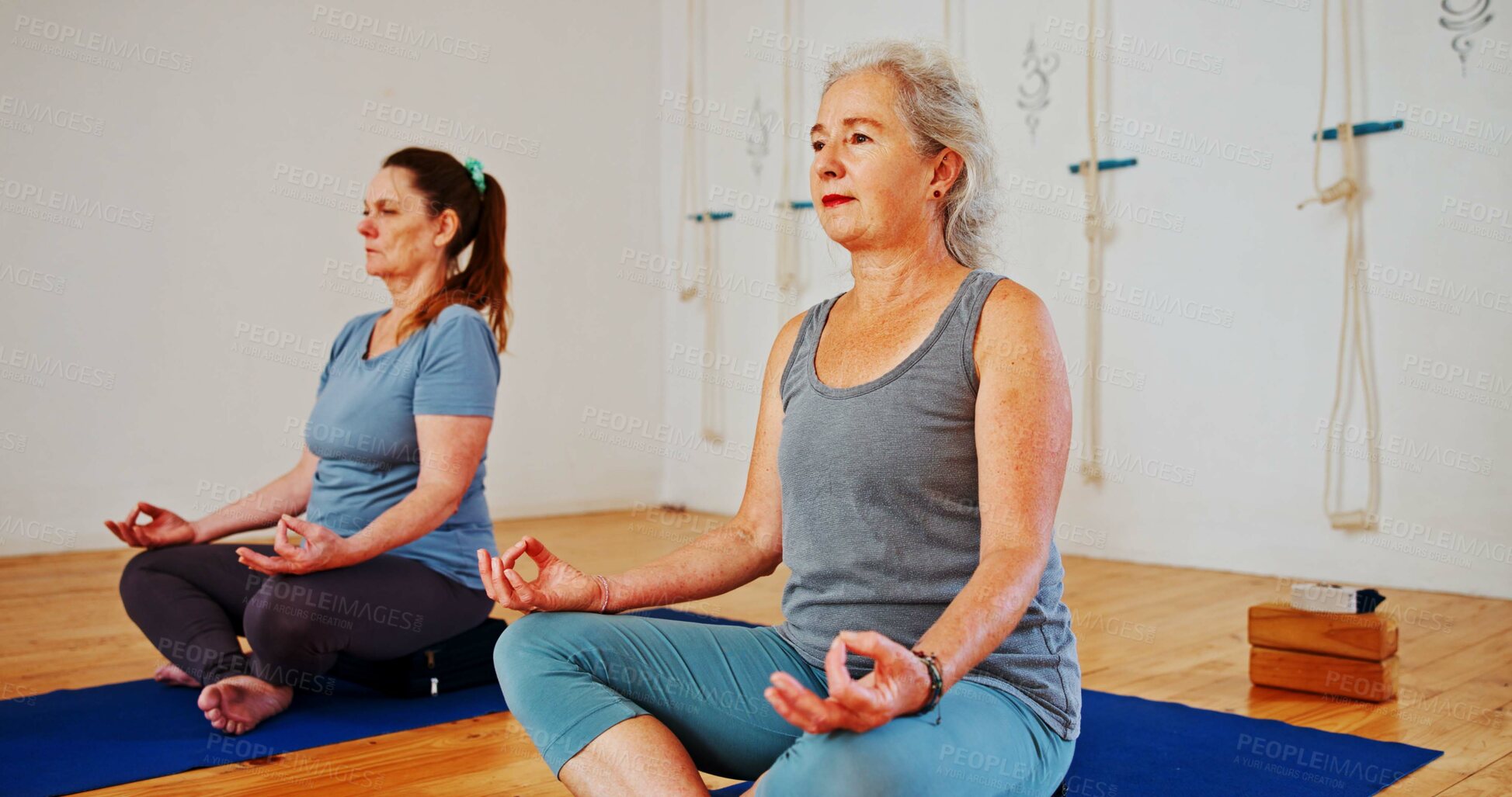 Buy stock photo Mature, lotus and women with group meditation for calm mindset, zen or peace in mental wellness. Posture, morning and people in class together for mindfulness, relax or holistic self care on yoga mat